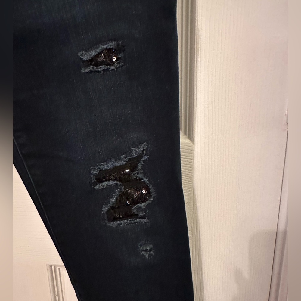 WHBM, dark blue, skinny jeans with black sequin embellishments.  Size 2 short.